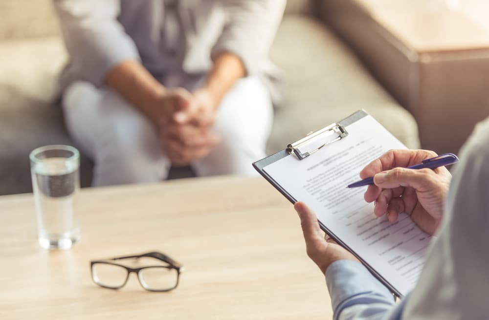 Cropped,Image,Of,Depressed,Man,At,The,Psychotherapist.,Doctor,Is